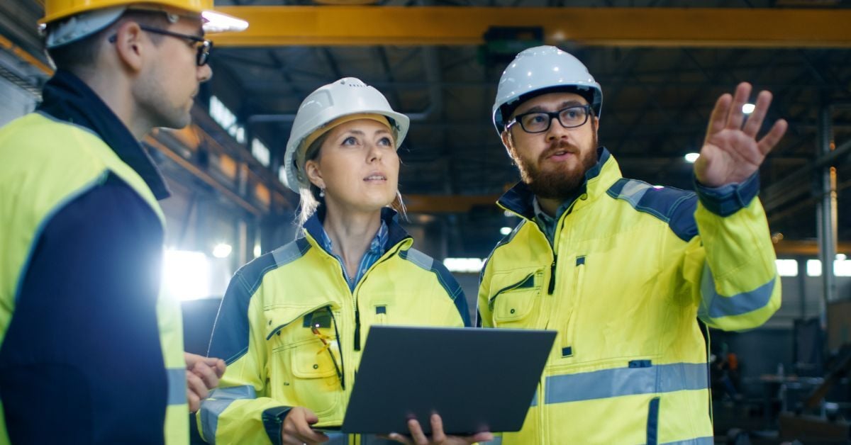 Construction workers planning together