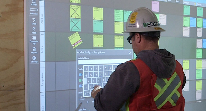 Construction worker using Nialli Visual Planner on-site