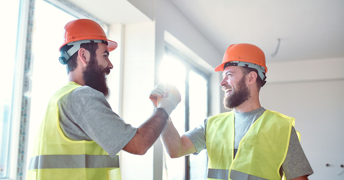 Construction workers celebrating a project completion