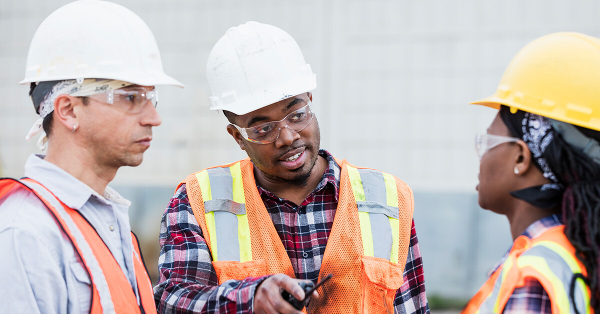 On-site construction team discussing a project