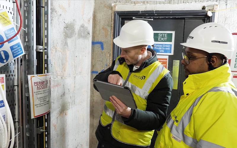 Mace team members using Nialli Visual Planner on a tablet at a project site