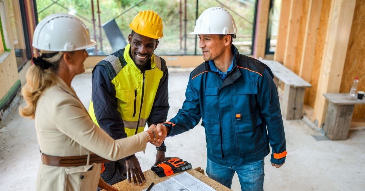 construction crew shaking hands