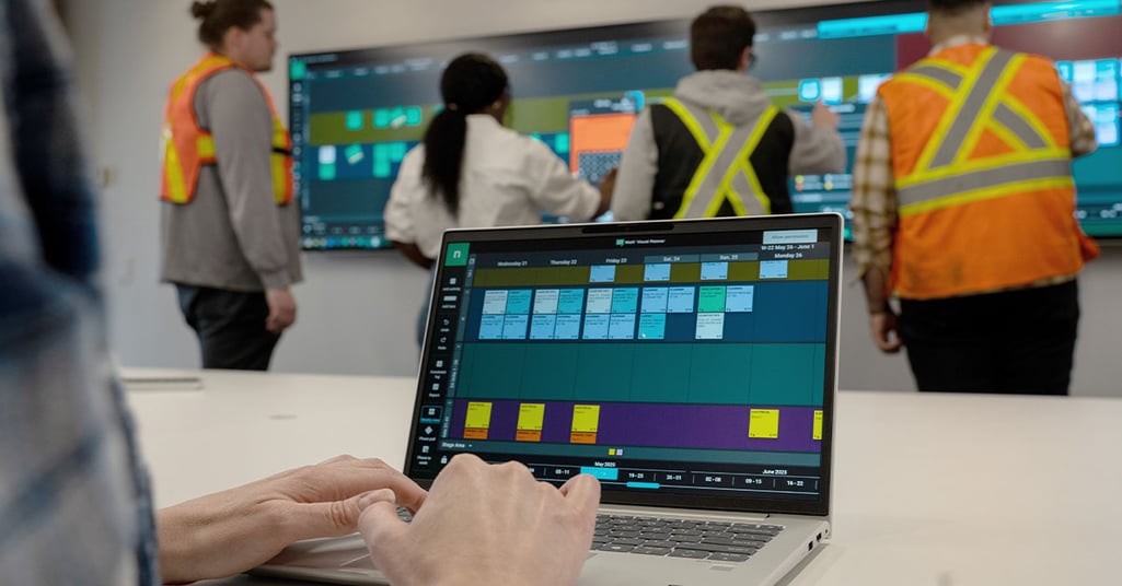 Nialli Visual Planner being used on a laptop and interactive display by a construction team