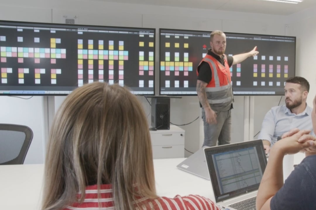 Nialli resources - customer stories. A construction team hosts a meeting with Nialli Visual Planner.