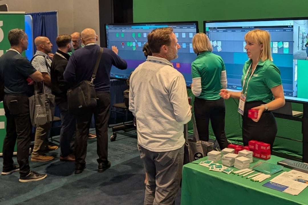 Nialli resources - upcoming events. Nialli employees talk to customers at a tradeshow event.